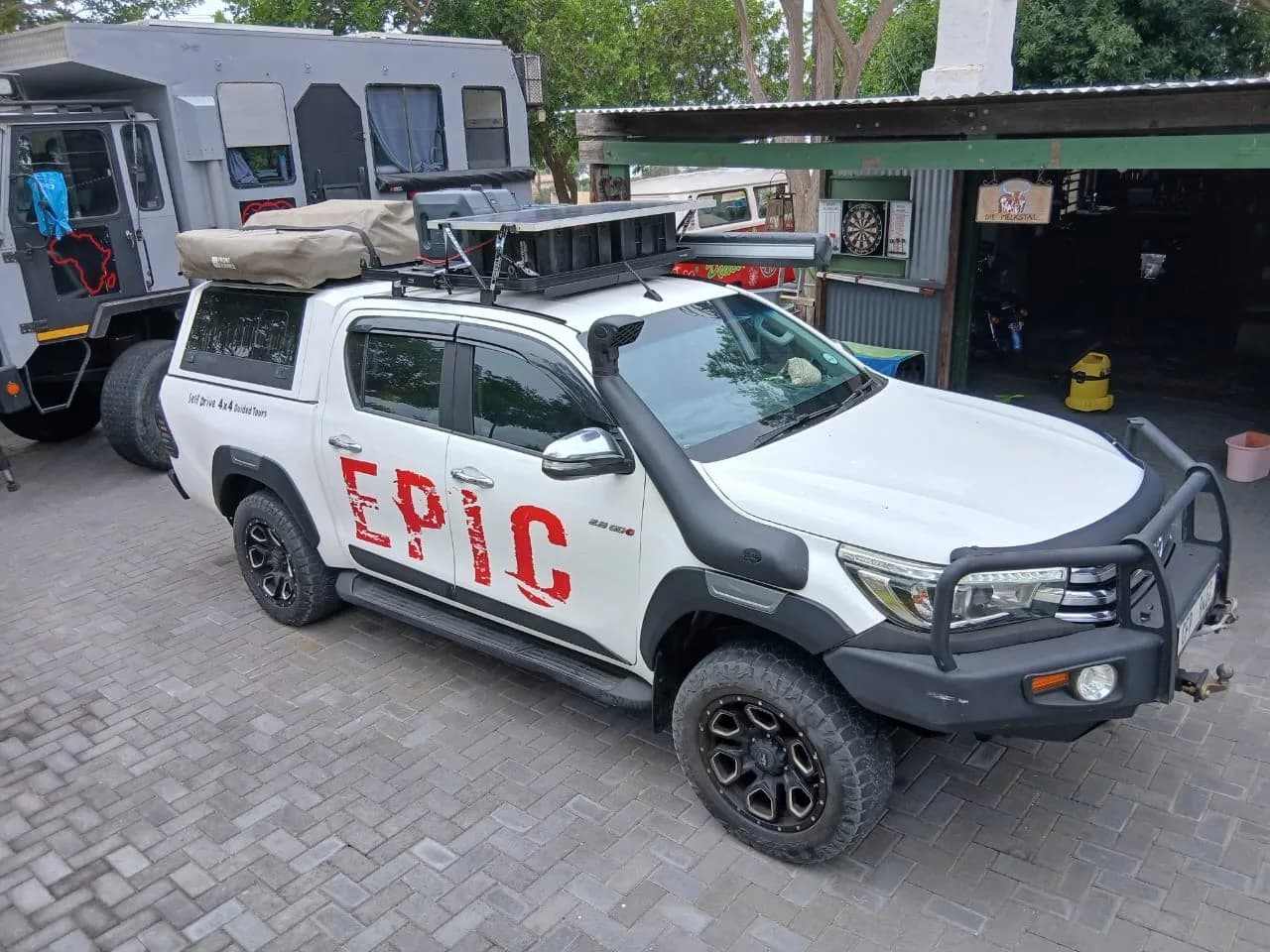 A fully-rigged Toyota Hilux, full side profile